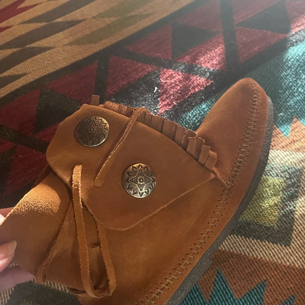Two-Button Boot has the shape of a boot and the soul of a moccasin. Brand new